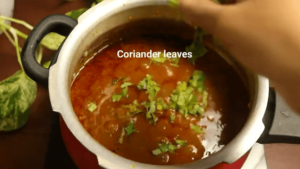 garnish chana masala gravy with coriander leaves