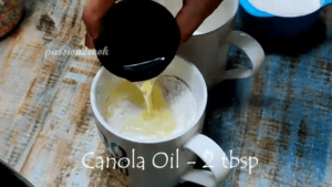 adding canola oil for vanilla mug cake in air afryer