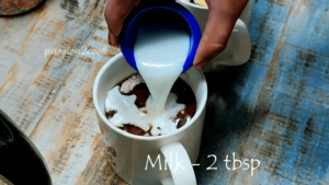 Adding milk to chocolate mug cake in air fryer