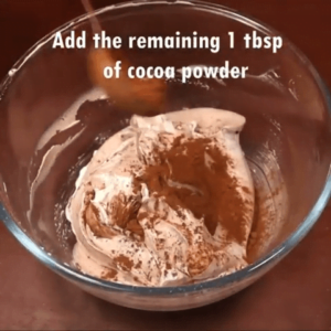 cocoa powder added to the whipping cream