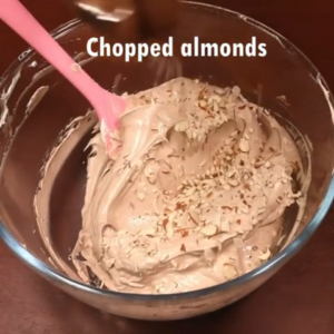 chopped almonds added to whipping cream