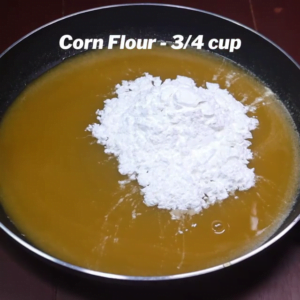 adding corn flour to orange juice